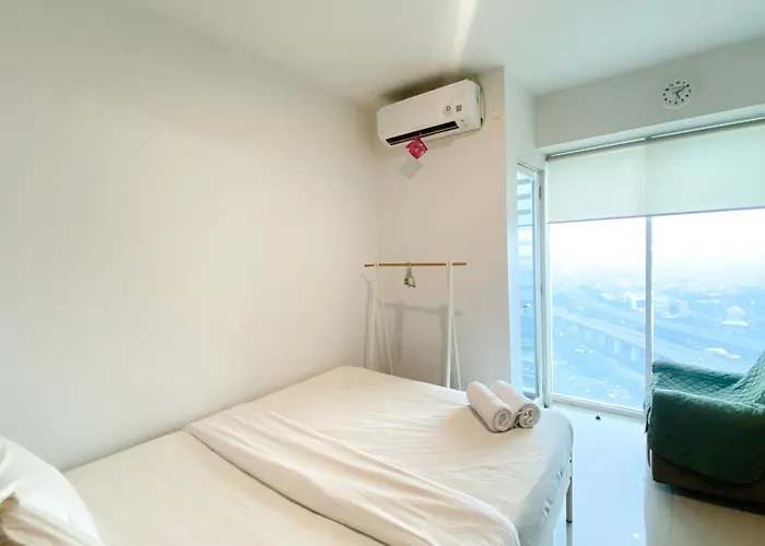 Modern And Homey Studio At Grand Kamala Lagoon Apartment By Travelio
